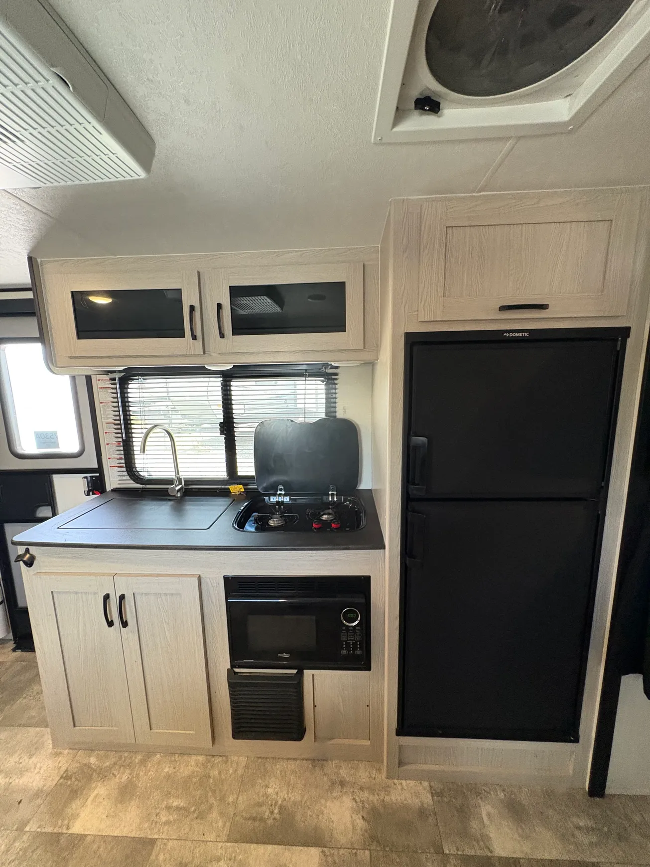 RV kitchen with stove and fridge