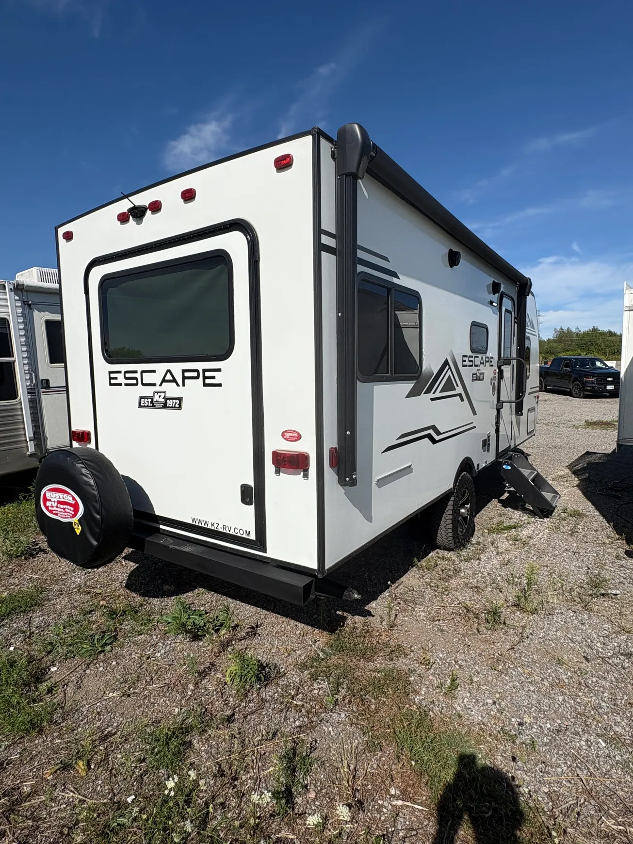 White travel trailer parked outdoors